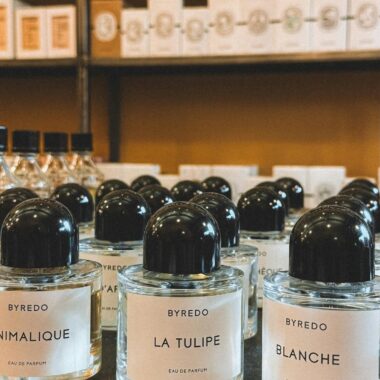 Elegant Byredo perfume bottles elegantly displayed in a Parisian store.